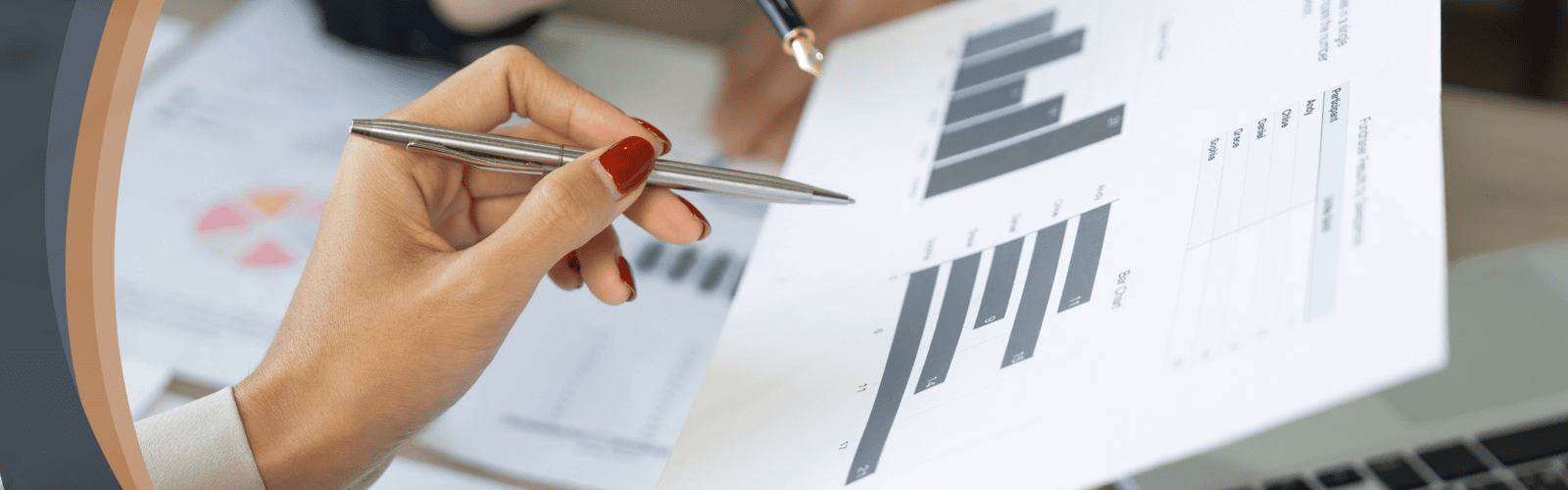 Hands reviewing printed data and charts with pens, representing Optimum Transitions' comprehensive resources, guides, and expert analysis for informed business transition planning