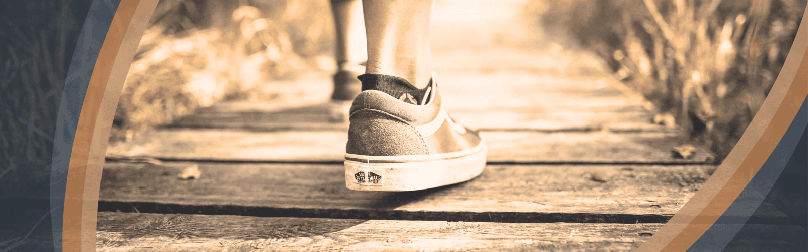 Person walking forward on a path symbolizing Optimum Transitions' guidance through strategic exit planning, succession, and business transition options