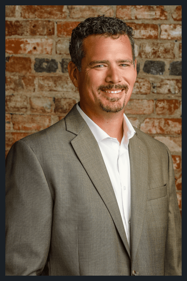 Drew Siebert rectangle portrait with brick background